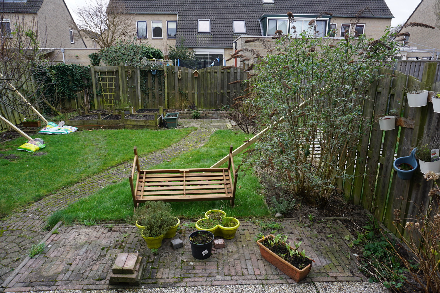 Garden overview with fallen over bench